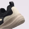 slip-on breathable running sneakers lightweight cushioned casual shoes in khaki, close-up view of the heel on a light gray background