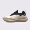 slip-on breathable running sneakers lightweight cushioned casual shoes in khaki, left side profile view on a light gray background