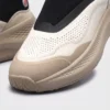 slip-on breathable running sneakers lightweight cushioned casual shoes in khaki, close-up view of the toe on a light gray background