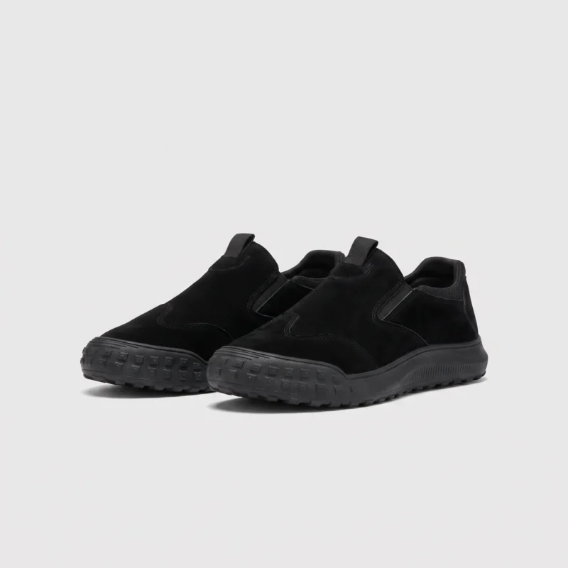 slip-on work safety shoes lightweight suede anti-slip driving shoes in black, front 45-degree view of the pair on a light gray background