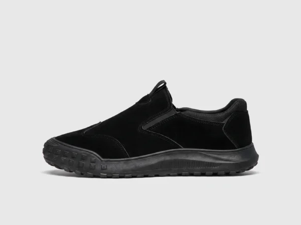 slip-on work safety shoes lightweight suede anti-slip driving shoes in black, left side profile view on a light gray background