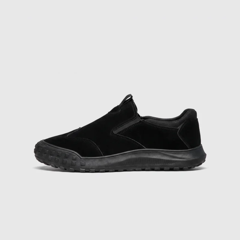 slip-on work safety shoes lightweight suede anti-slip driving shoes in black, left side profile view on a light gray background