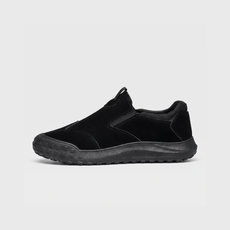 slip-on work safety shoes lightweight suede anti-slip driving shoes in black, right side profile view on a light gray background