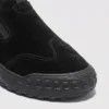 slip-on work safety shoes lightweight suede anti-slip driving shoes in black, close-up view of the toe on a light gray background