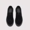 slip-on work safety shoes lightweight suede anti-slip driving shoes in black, top-down view of the pair on a light gray background