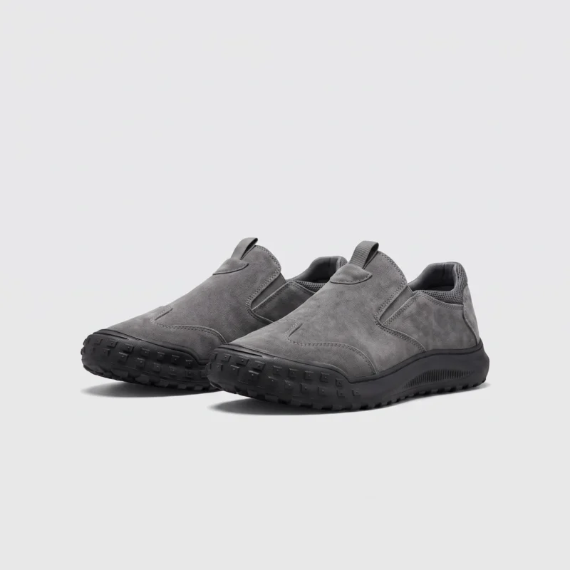 slip-on work safety shoes lightweight suede anti-slip driving shoes in gray, front 45-degree view of the pair on a light gray background