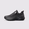 trendy rotating dial closure casual sneakers breathable chunky sole commuter shoes in black, left side profile view on a light gray background
