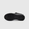 trendy rotating dial closure casual sneakers breathable chunky sole commuter shoes in black, outsole tread view on a light gray background