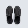trendy rotating dial closure casual sneakers breathable chunky sole commuter shoes in black, top-down view of the pair on a light gray background