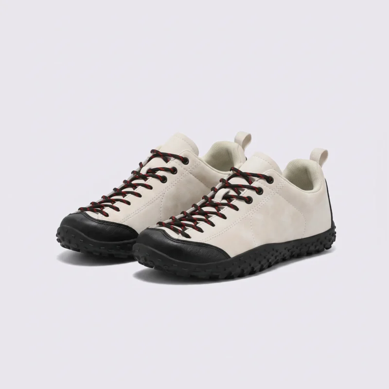wide toe box barefoot hiking sneakers in beige, front 45-degree view of the pair on a light gray background