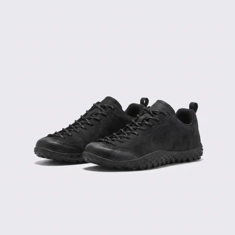 wide toe box barefoot hiking sneakers in black, front 45-degree view of the pair on a light gray background