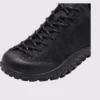wide toe box barefoot hiking sneakers in black, close-up view of the toe on a light gray background
