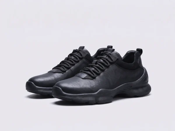 leather breathable hiking walking shoes lightweight non-slip outdoor sneakers in black, front 45-degree view of the pair on a light gray background