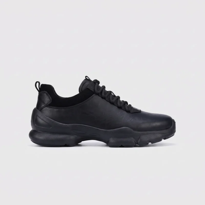leather breathable hiking walking shoes lightweight non-slip outdoor sneakers in black, right side profile view on a light gray background